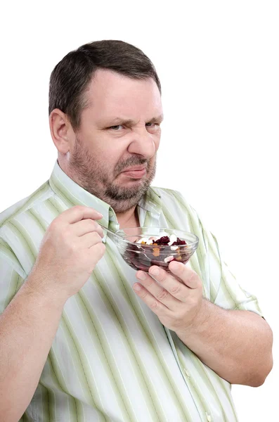 Guy has a deep-seated aversion to beet salad — 图库照片