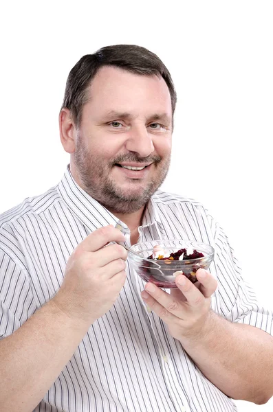 Bearded guy is fond of a beet salad — Stock Photo, Image