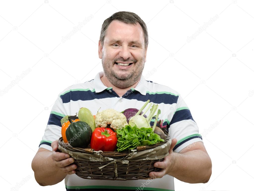 Guy offering fresh vegetables for sale
