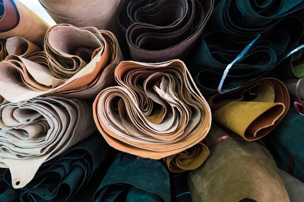 Stock image Overlap of genuine cow leather on shelf with many colour