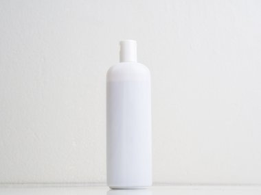 White  plastic bottle for cosmetic on white clipart