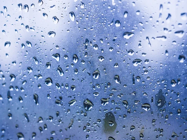 Close up water drops on blue background — Stock Photo, Image