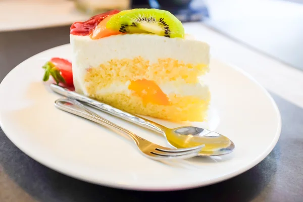 Cheese cake and mix fruits on white dish, Cake with fruits