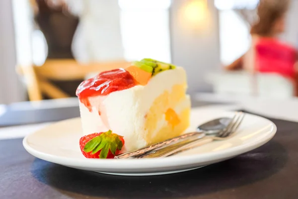 Cheese cake and mix fruits on white dish, Cake with fruits