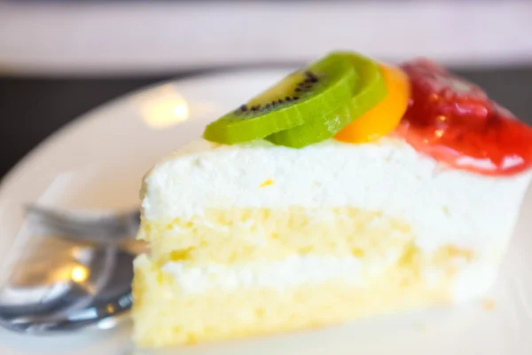 Cheese cake and mix fruits on white dish, Cake with fruits