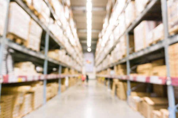 Blurred image of shopping mall with row of shelf in big store