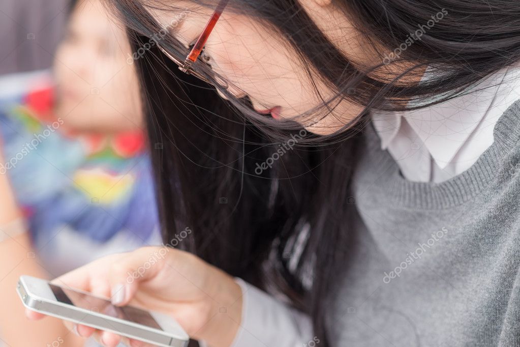 Cute Asian Woman Using Her Cellphone Living Room Women Glasses