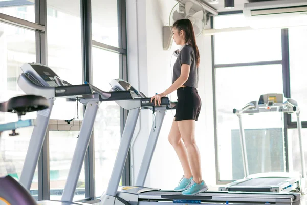 Young asian woman working exercise in the gym, Attractive asian girl