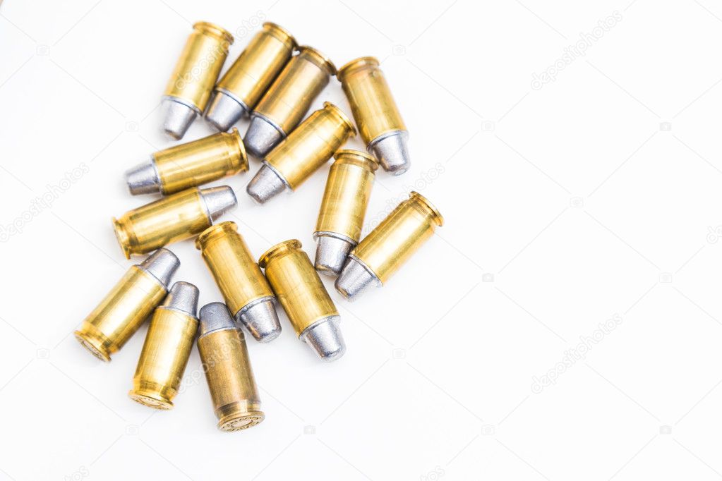 Group of 45 caliber bullets pistols ammo isolated on a white background.