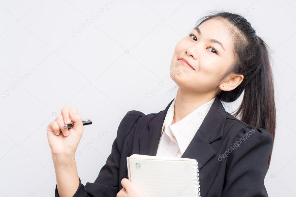 Portrait of happy asian smiling business woman with booklet wear