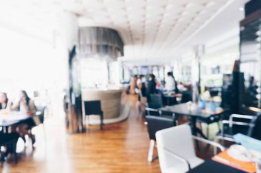 Soyut bulanık Bokeh insanlar otel restoranında sabah kahvaltısında oturuyor.