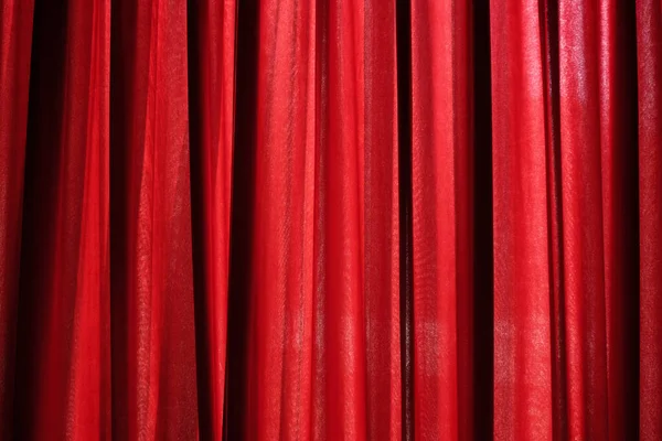 Luxury red closed curtain with light spots in a theater, Red curtain