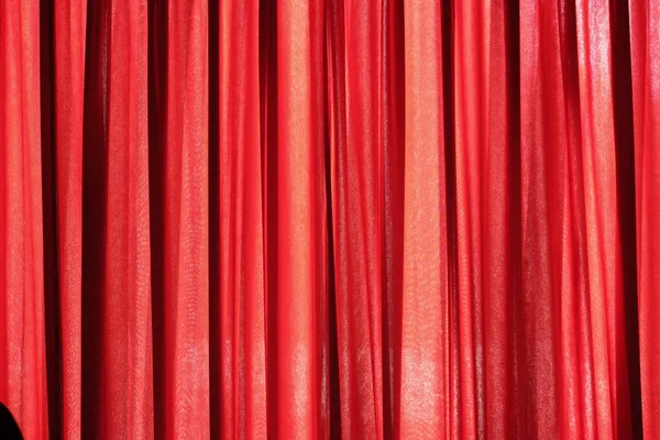 Luxury red closed curtain with light spots in a theater, Red curtain