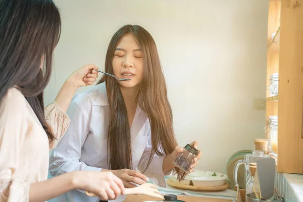 Beautiful Asian Casual Girl Tasting Food Smiling While Cooking Kitchen — Foto Stock