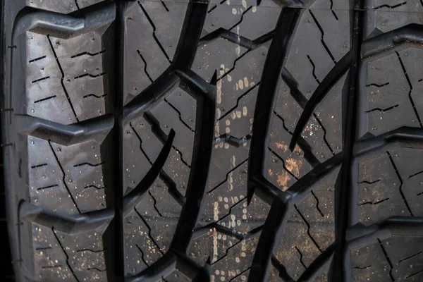 New car tire texture in garage car shop black tire background