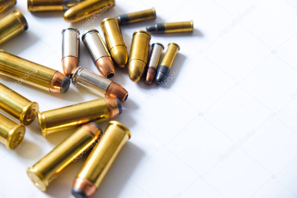 Group of pistol bullet .44 magnum 9mm and .45 on white background criminal concept