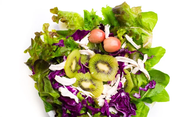 Giwifruit salad with tomato and green leaf — Stock Photo, Image