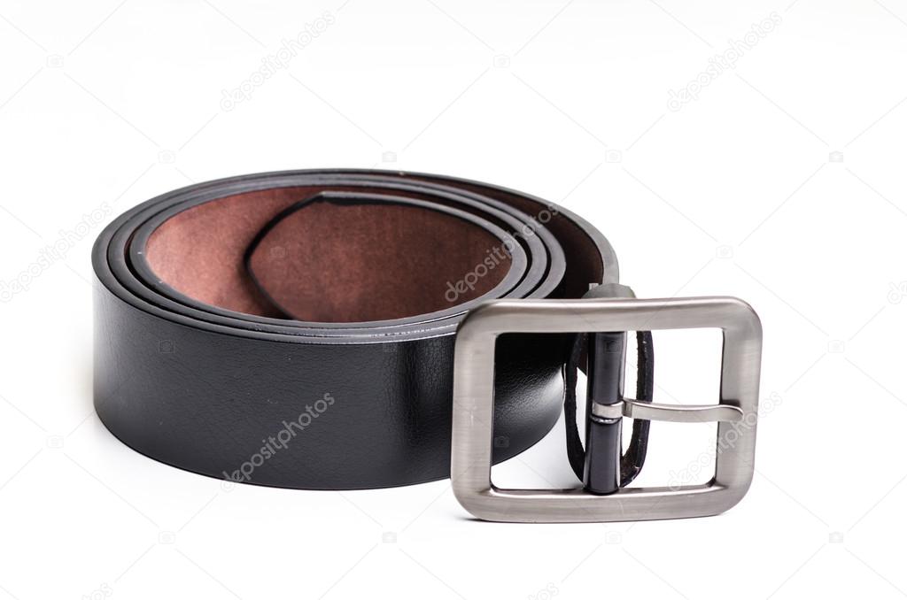 Elegant man's black leather belt rolled up isolated on white.