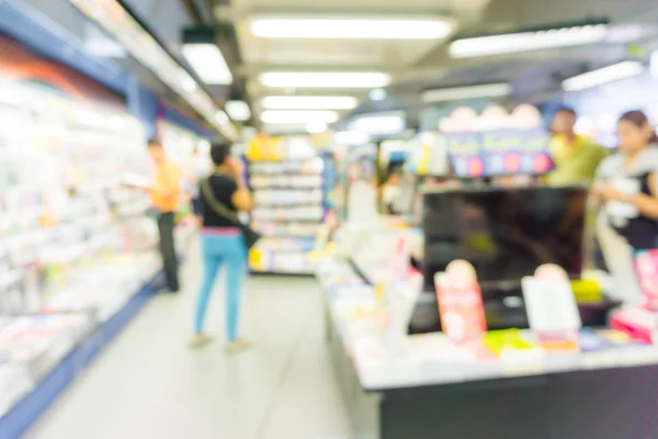 Abstract blurred people walking in book store — Stock Photo, Image