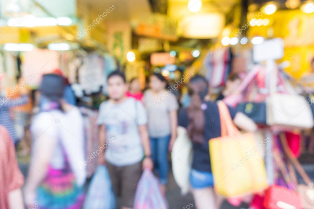 Blur of tourists are walking and shopping in Chatuchak market