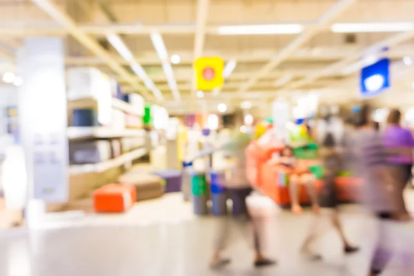 Loja de fundo borrão com bokeh, Pessoas que compram no departamento — Fotografia de Stock