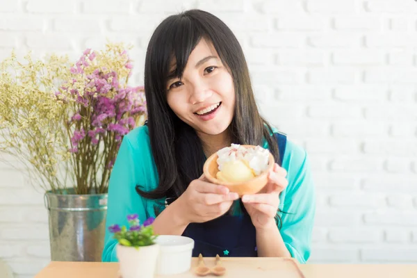 Happy Asian girl with ice cream look joyful and cheerful. — Stock Photo, Image