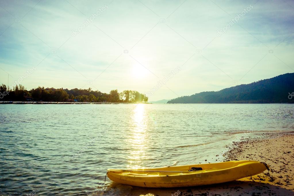 Yellow kayak on the sea. Kayaking on island