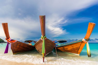 Traditional longtail boats in the famous Lipe island clipart