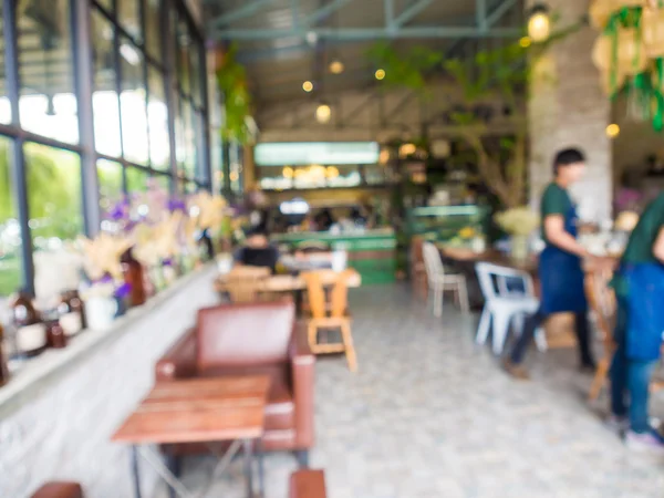 Imagen borrosa de la cafetería y la gente — Foto de Stock