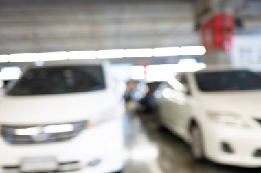 Soyut bulanık boş modern araba otoparkı iç market mağaza taşımacılığı arkaplanı