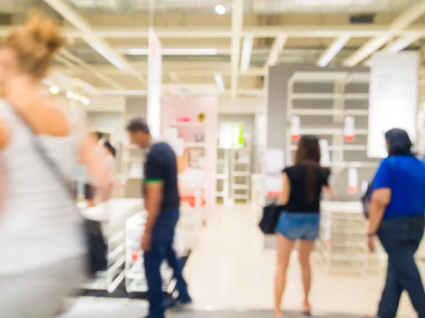 Blurred image of people shopping at mall of home decor