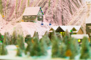 snowy winter scene of a small hamlet model clipart