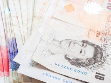 Büyük Britanya'nın Lirası para üzerine beyaz yaymak