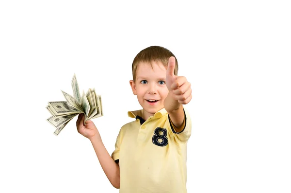 Смеющийся мальчик держит стопку 100 долларов купюр и шоу — стоковое фото