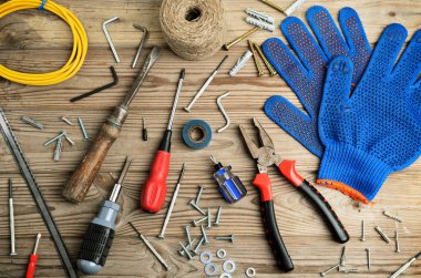 gloves and set of tools on a wooden table horizontal