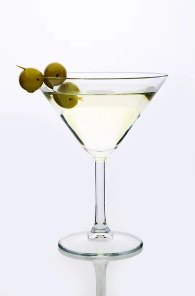 Glass martini with olive  light background — Stock Photo, Image