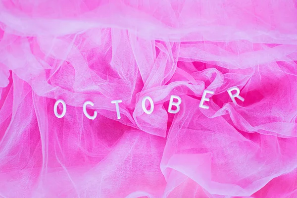 Lapos feküdt top kilátás szó október rózsaszín háttér. Október a mellrák tudatosság hónap — Stock Fotó