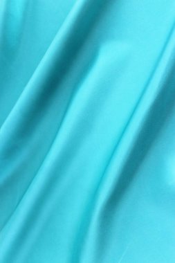 Mavi saten arka plan. Pileli ipek kumaş. Saten, ipek ya da saten güzel bir örtü oluşturur. Moda tasarımı, arkaplan.