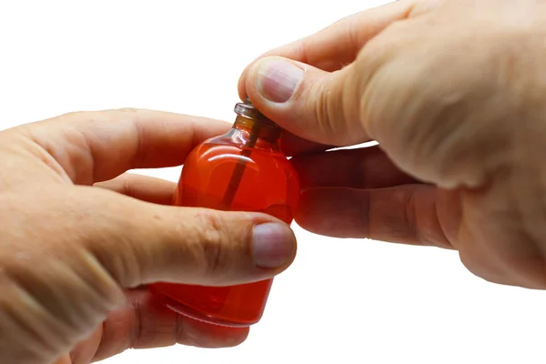 Manos Con Una Botella Vidrio Aceite Fragante Oriental Cerca Aislado Fotos De Stock