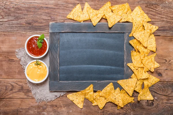 Mexican nacho with sauces and chalk board — Stock Photo, Image