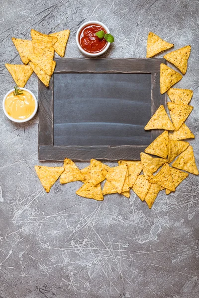 Mexican nacho with sauces and chalk board — Stock Photo, Image