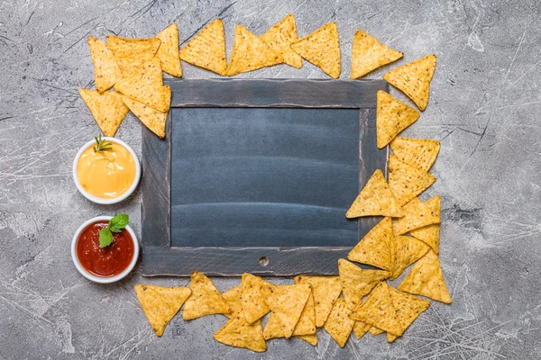 Mexican nacho with sauces and chalk board — Stock Photo, Image