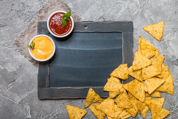 Mexican nacho with sauces and chalk board — Stock Photo, Image