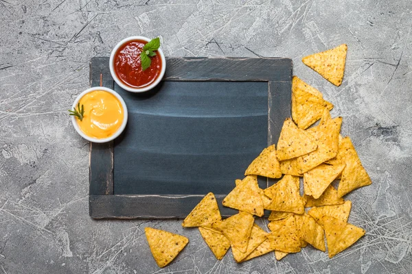 Mexican nacho with sauces and chalk board — Stock Photo, Image