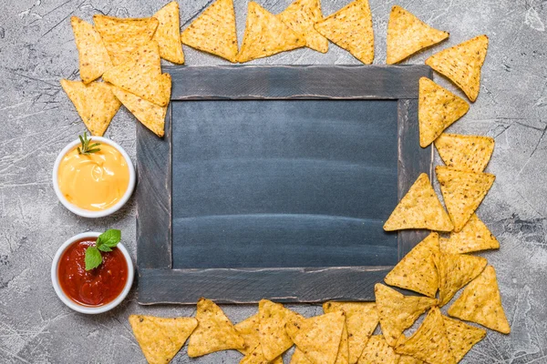 Mexican nacho with sauces and chalk board — Stock Photo, Image