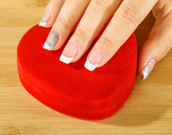 Beautiful woman hand with france manicure — Stock Photo, Image