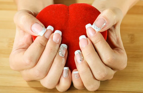 Beautiful woman hand with france manicure — Stock Photo, Image