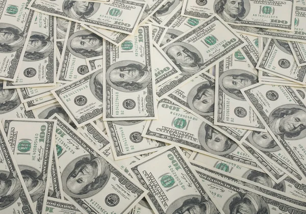 Σωρό αμερικανικά δολάρια ως φόντο — Φωτογραφία Αρχείου