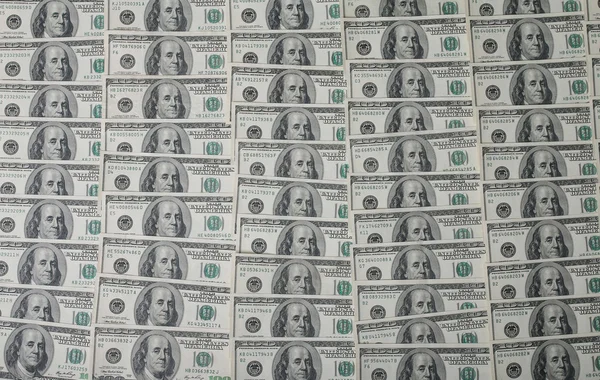 Σωρό αμερικανικά δολάρια ως φόντο — Φωτογραφία Αρχείου