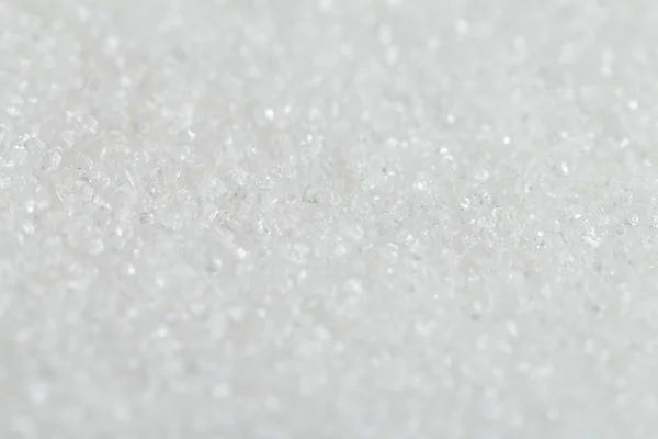 Zucchero di canna biologico bianco su uno sfondo. Focus selettivo — Foto Stock